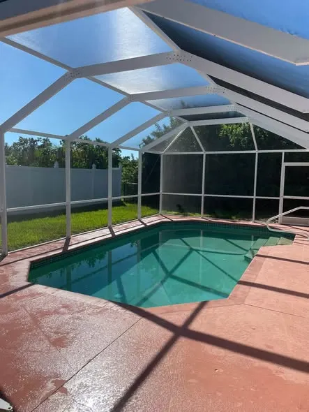 Pool cage and deck before cleaning in Rotonda