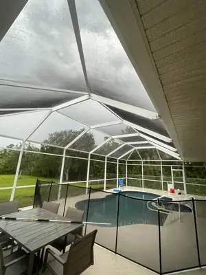 Pool cage screens dull with buildup before cleaning