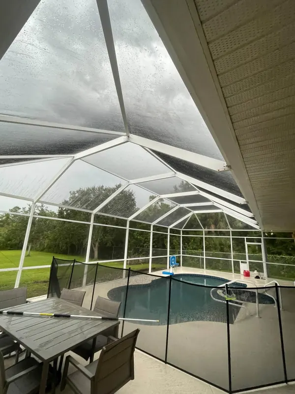 Pool cage screens dull with buildup before cleaning
