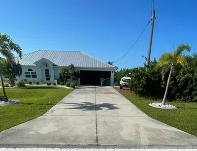 Long concrete driveway after pressure washing