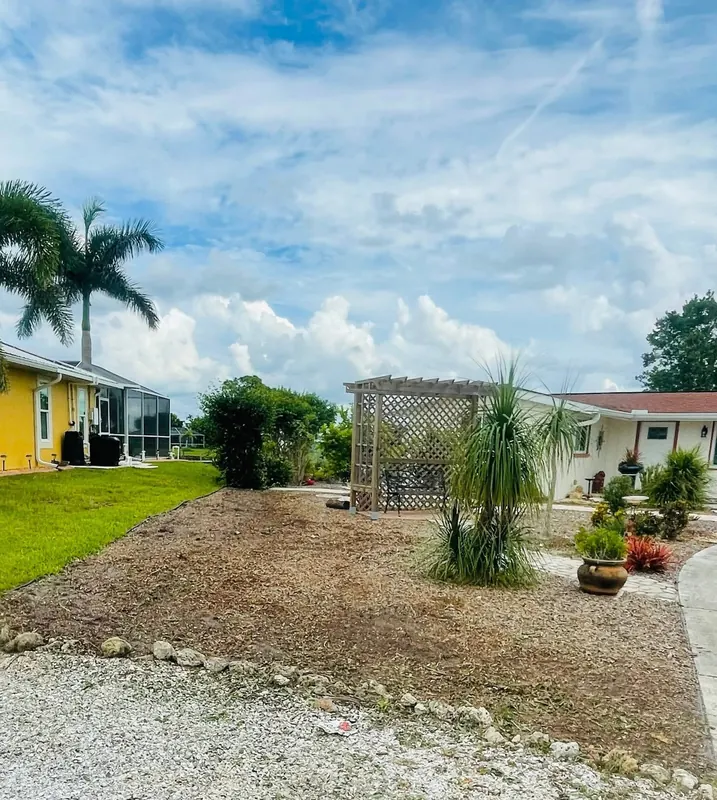 Gravel and mulch beds laid out in a front yard