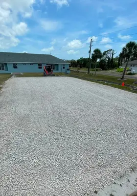 Same parking area with fresh crushed gravel spread and graded