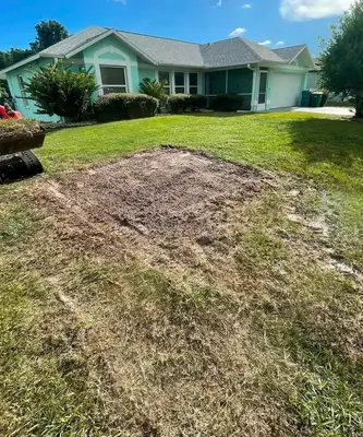 Bare patch of yard prepped for grading and sod