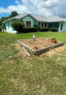 Raised timber bed frame built in a graded yard