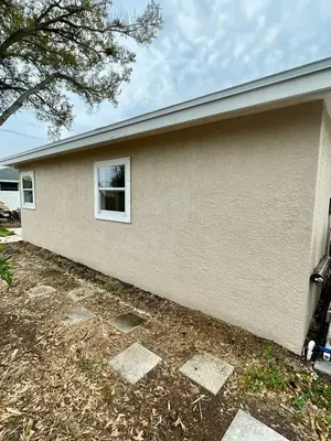Same stucco wall clean after soft washing