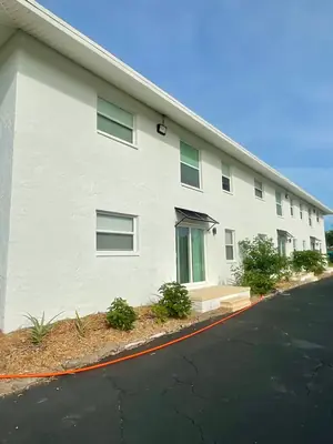 Bright white two story building after soft washing